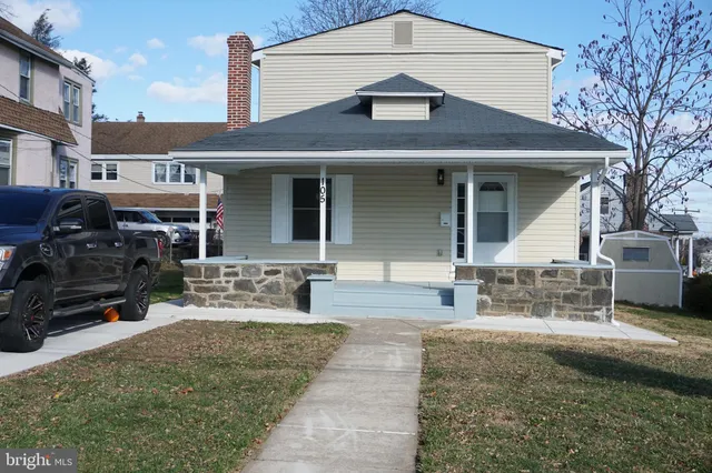 a view of a house with a snow in the yard