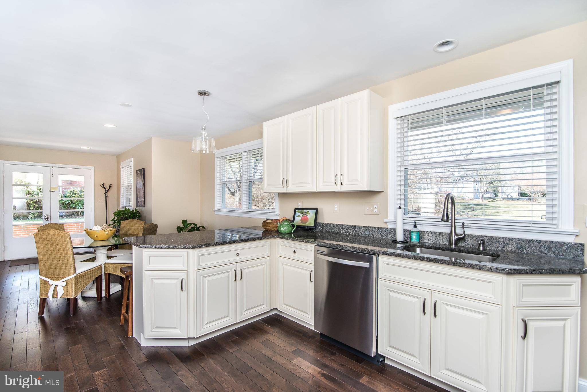 4042 High Point Road Ellicott City, MD 21042 - Photo 13 of 29 a kitchen with white cabinets sink and window