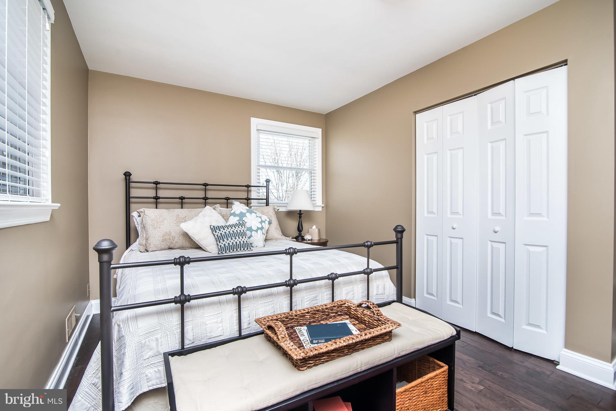 4042 High Point Road Ellicott City, MD 21042 - Photo 19 of 29 a bedroom with a bed and wooden floor