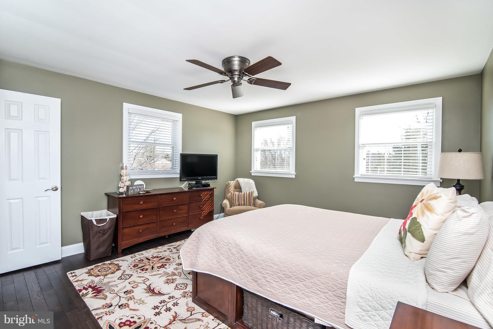 4042 High Point Road Ellicott City, MD 21042 - Photo 20 of 29 a bedroom with a bed and a dresser