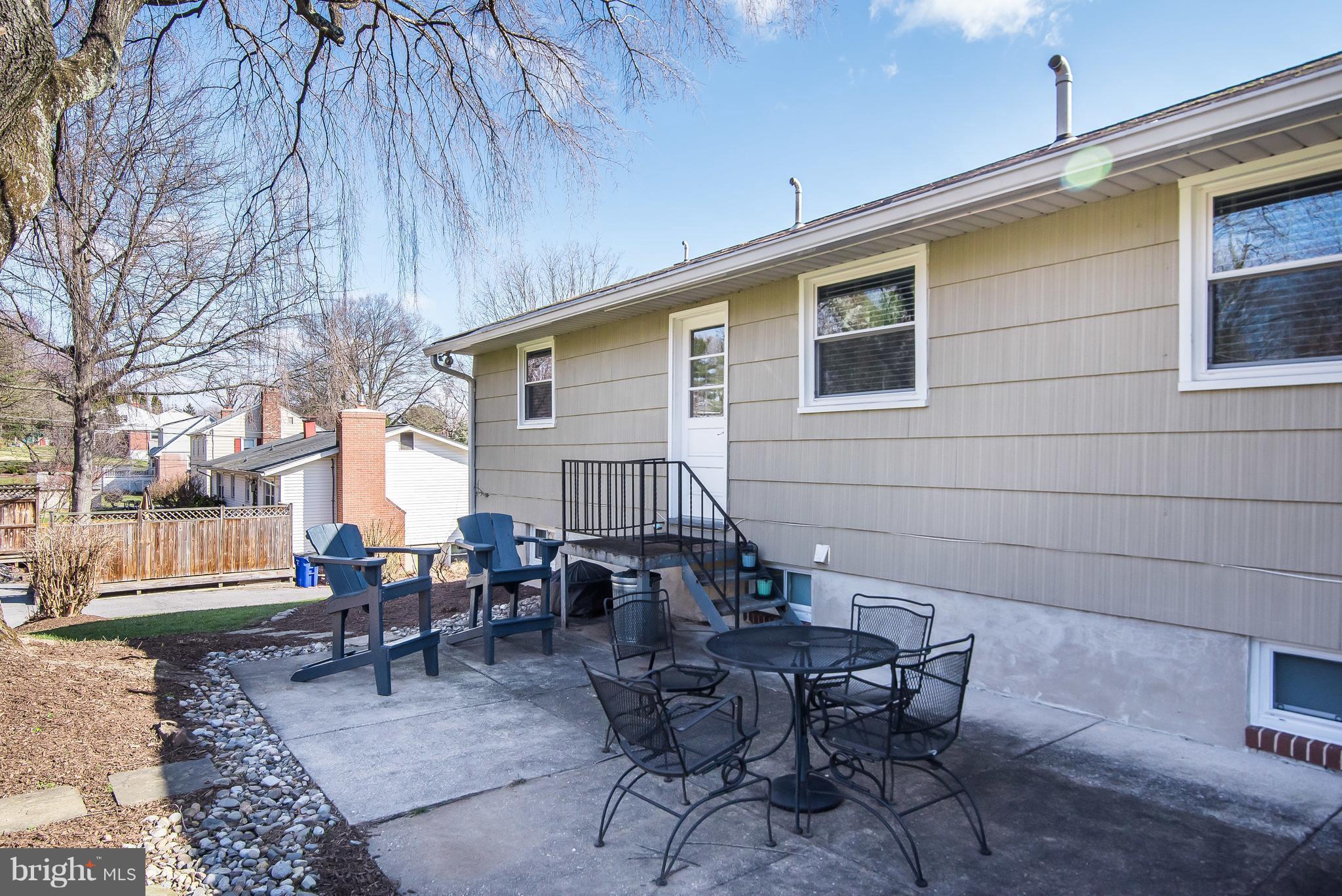 4042 High Point Road Ellicott City, MD 21042 - Photo 26 of 29 a backyard of a house with outdoor seating