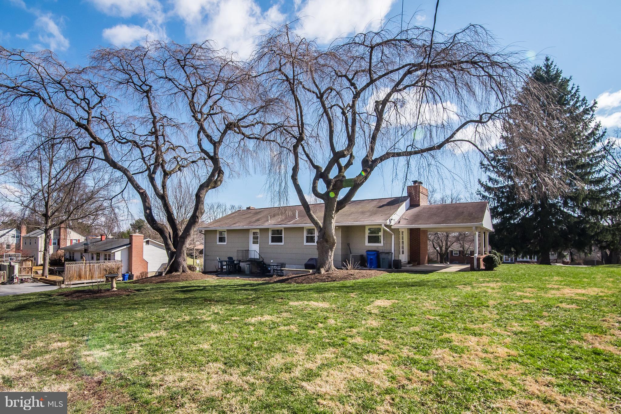 4042 High Point Road Ellicott City, MD 21042 - Photo 28 of 29 a view of a house with a big yard and large trees