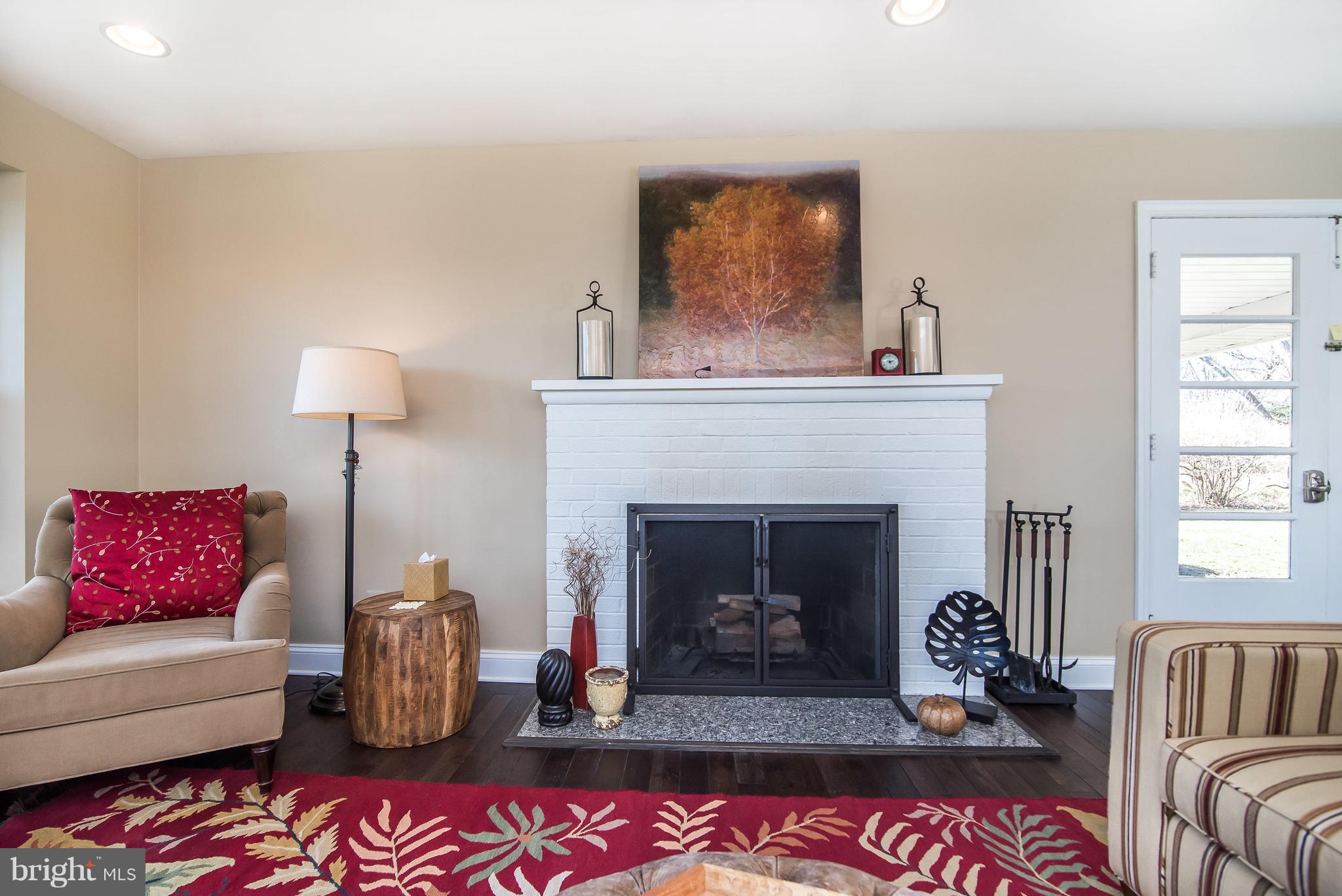 4042 High Point Road Ellicott City, MD 21042 - Photo 6 of 29 a living room with furniture and a fireplace