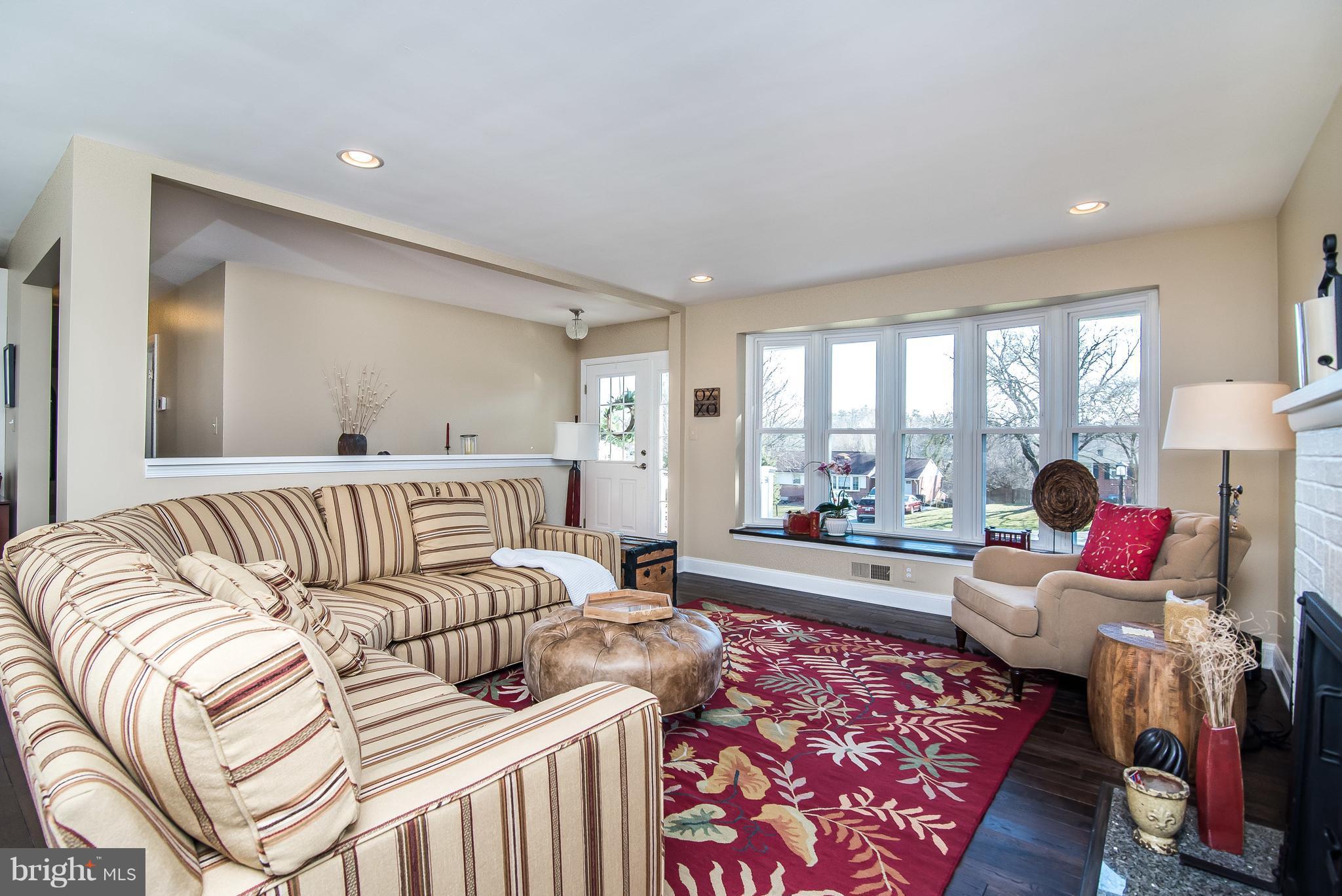 4042 High Point Road Ellicott City, MD 21042 - Photo 7 of 29 a living room with furniture fireplace and a large window