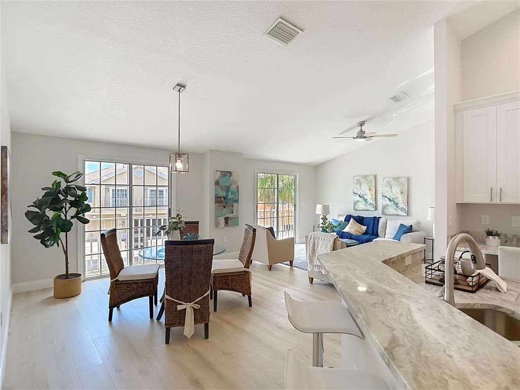 5310 Anhinga Trail New Port Richey, FL 34653 - Photo 12 of 27 a view of a livingroom with furniture window and wooden floor