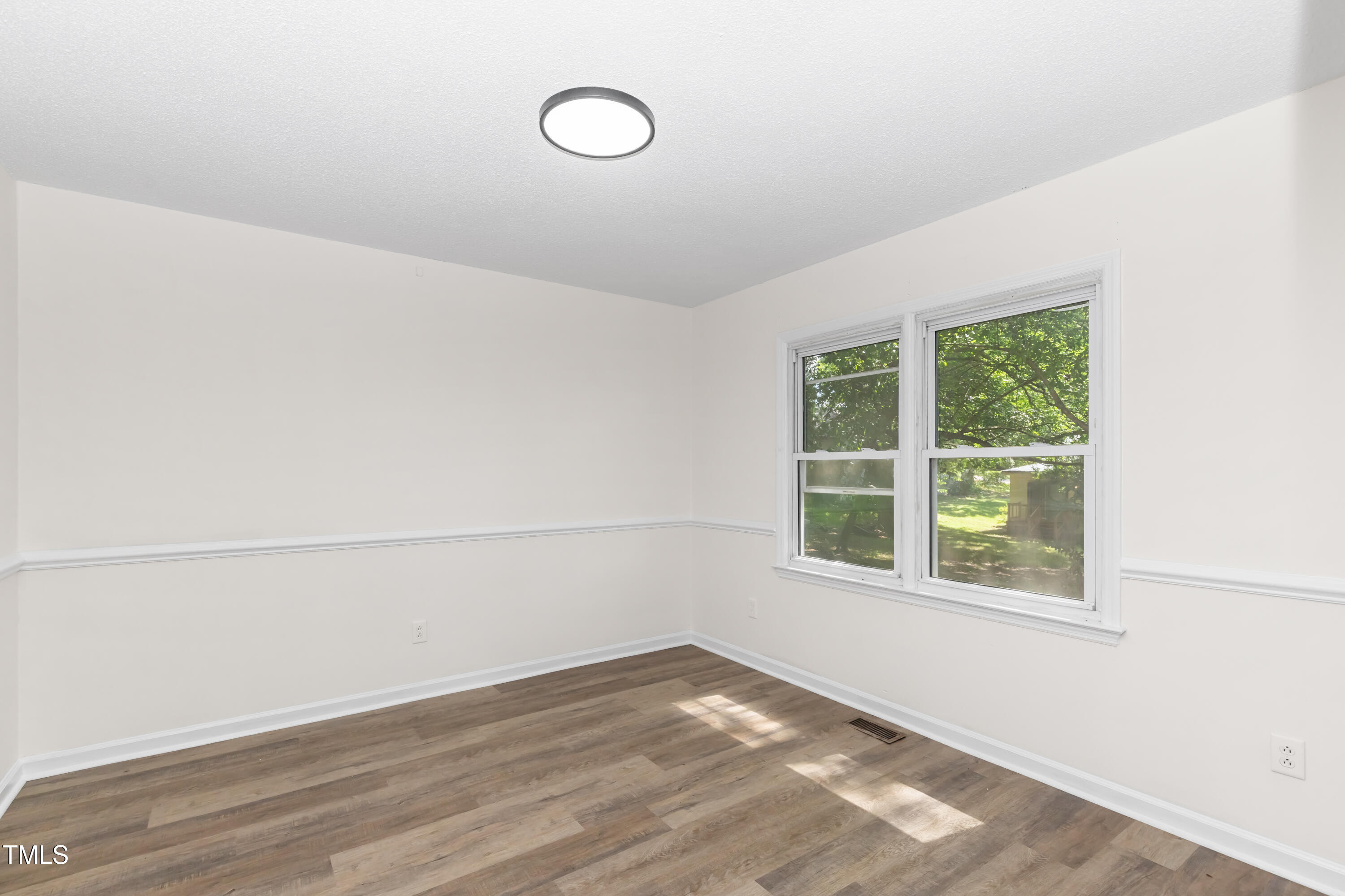 726 West M Street Erwin, NC 28339 - Photo 19 of 26 a view of a room that has a window in it