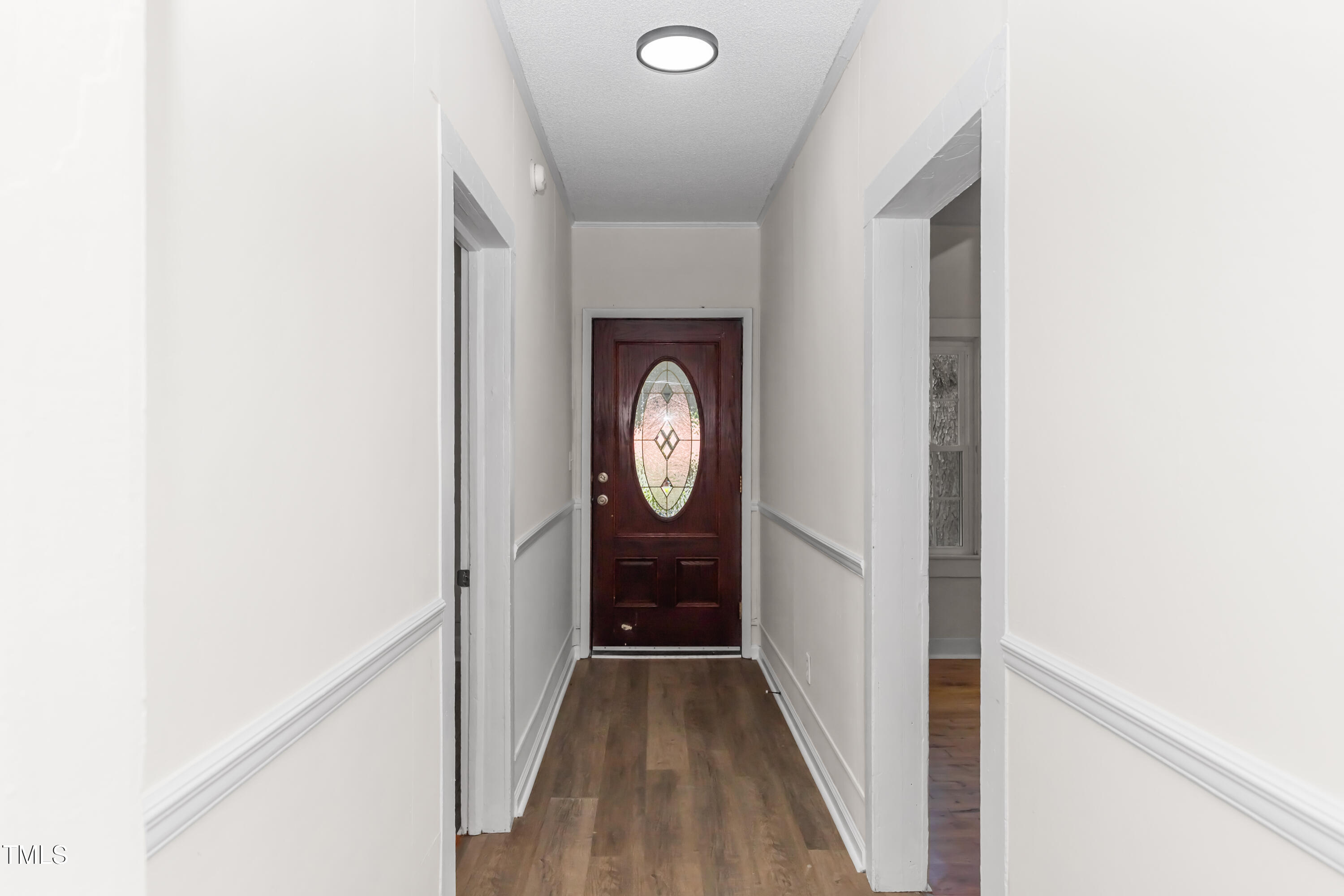 726 West M Street Erwin, NC 28339 - Photo 7 of 26 a view of hallway with wooden floor