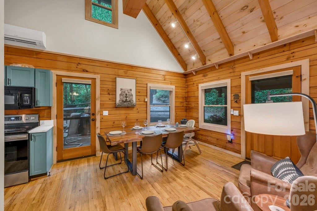 192 Dewitt Barnett Road, Unit 2 Vilas, NC 28692 - Photo 11 of 32 a view of a dining room with furniture window and wooden floor