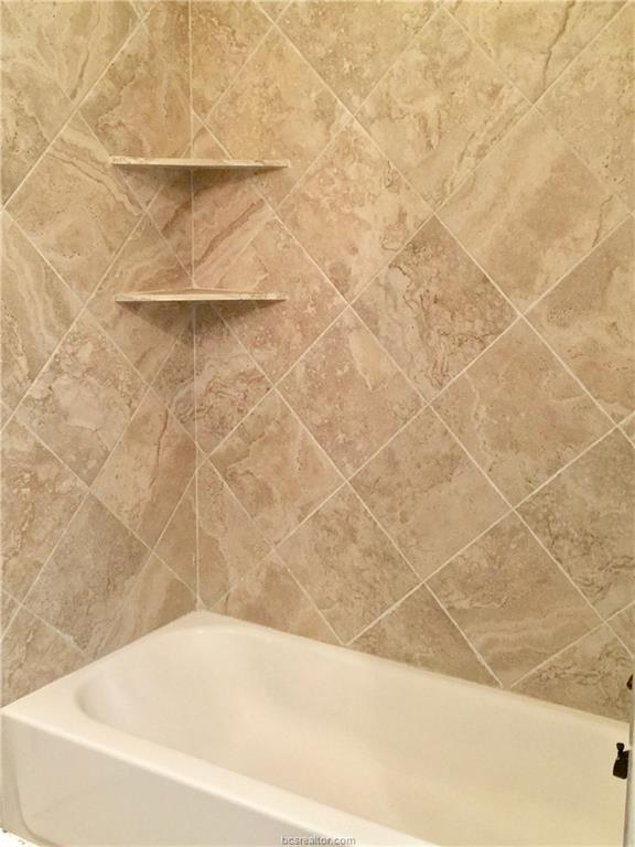 109 Ehlinger Drive Bryan, TX 77801 - Photo 13 of 25 a bathroom with a bathtub