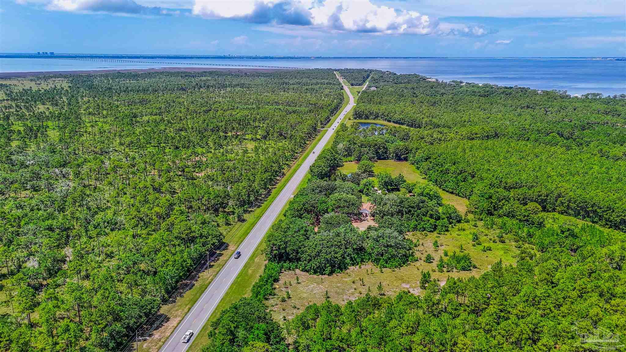 939 Avalon Boulevard Milton, FL 32583 - Photo 15 of 56 a view of a yard with plants