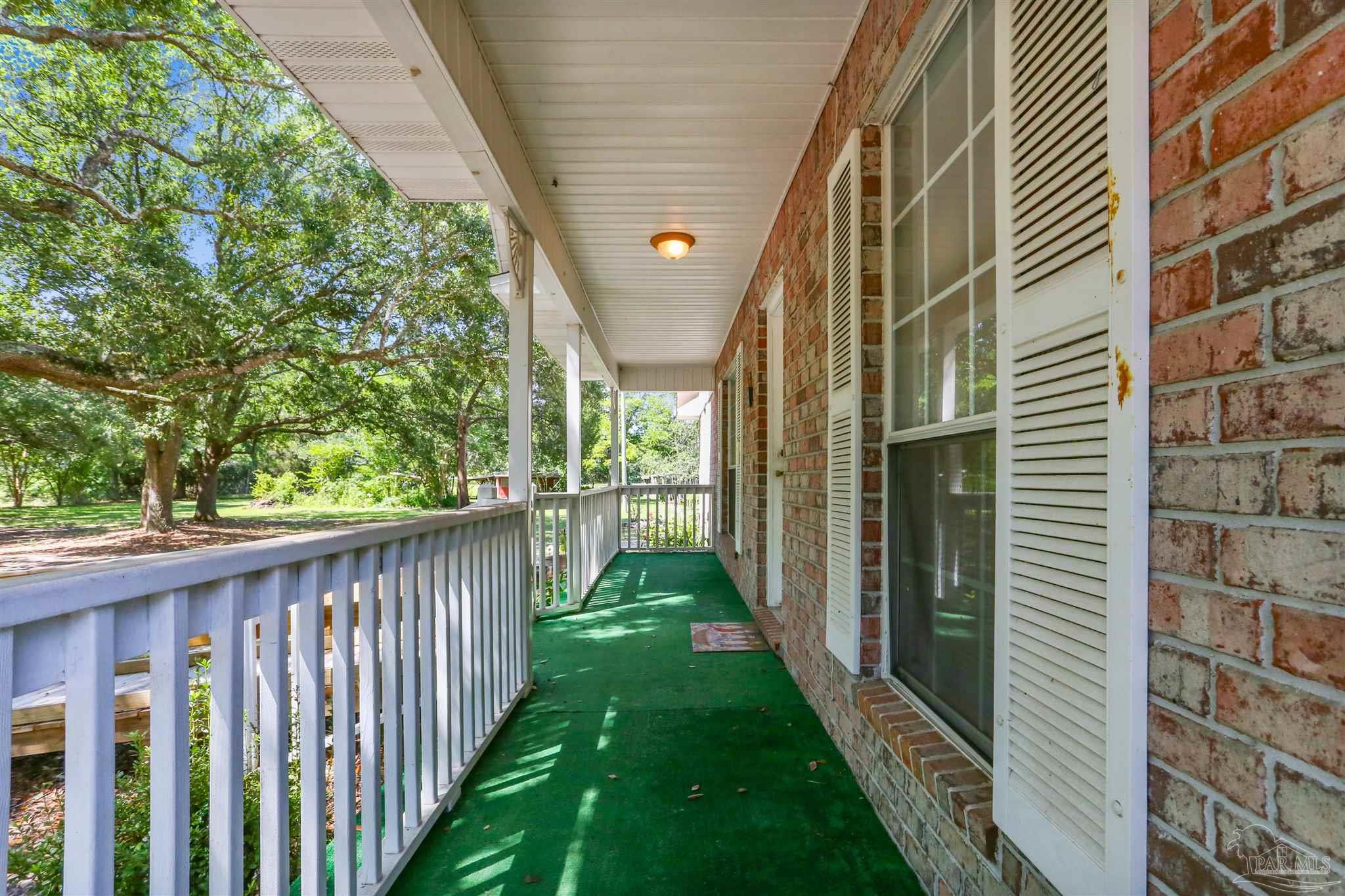 939 Avalon Boulevard Milton, FL 32583 - Photo 22 of 56 a view of a porch