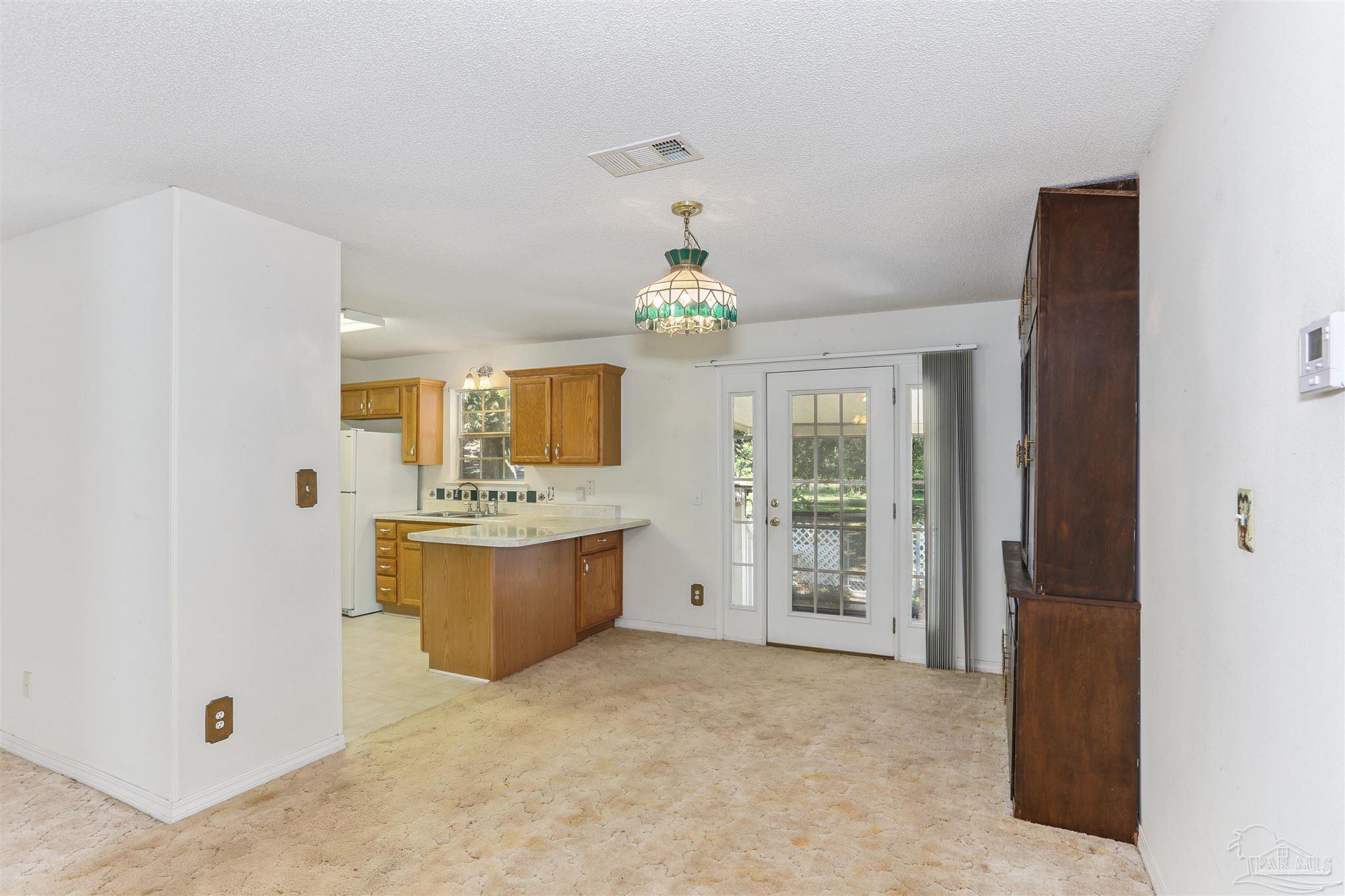 939 Avalon Boulevard Milton, FL 32583 - Photo 26 of 56 a large bathroom with a tub sink and mirror