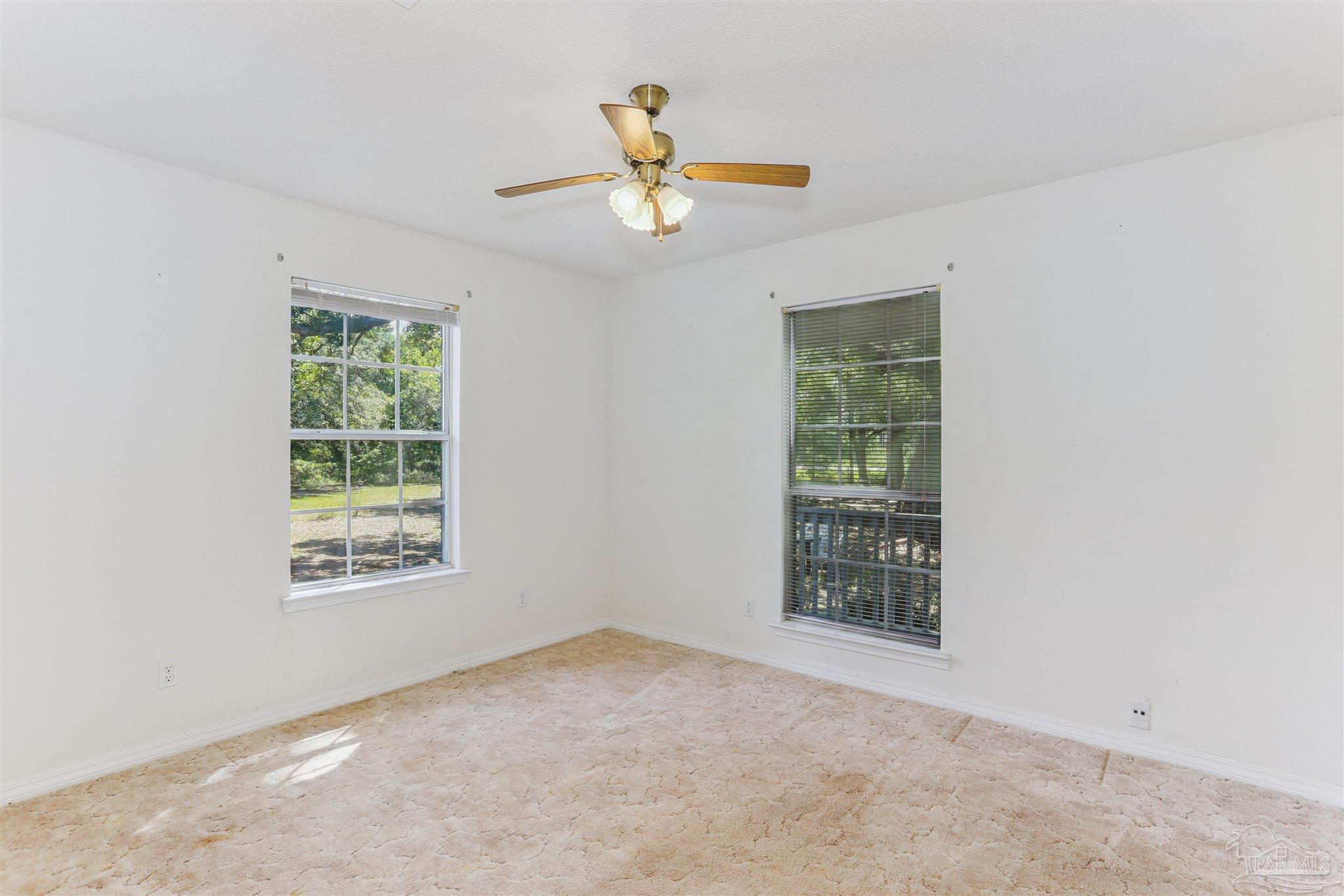 939 Avalon Boulevard Milton, FL 32583 - Photo 31 of 56 a view of an empty room with a window