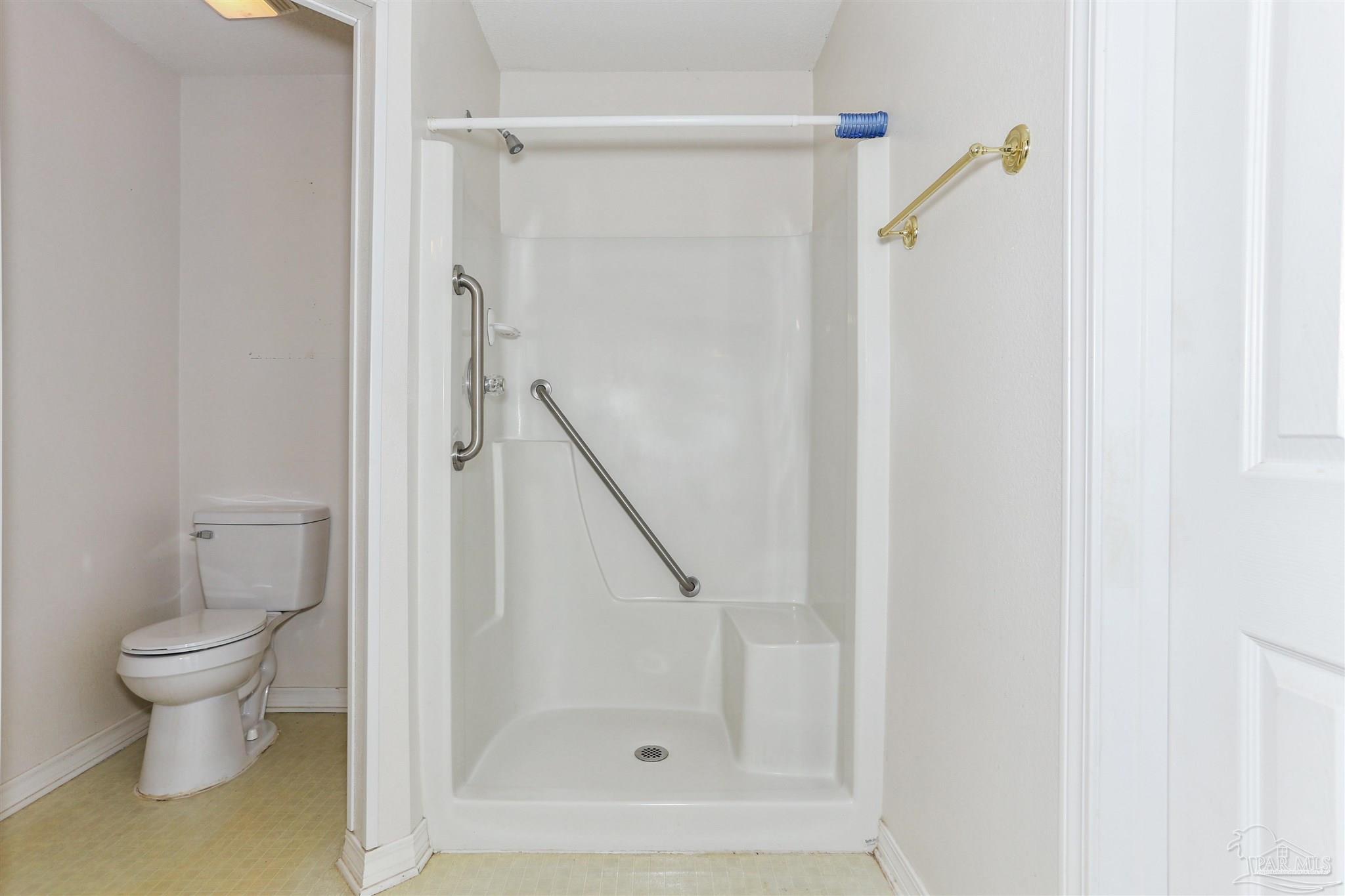 939 Avalon Boulevard Milton, FL 32583 - Photo 39 of 56 a bathroom with a shower and a toilet