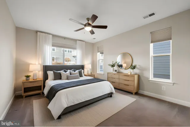 a bedroom with bed chair and window