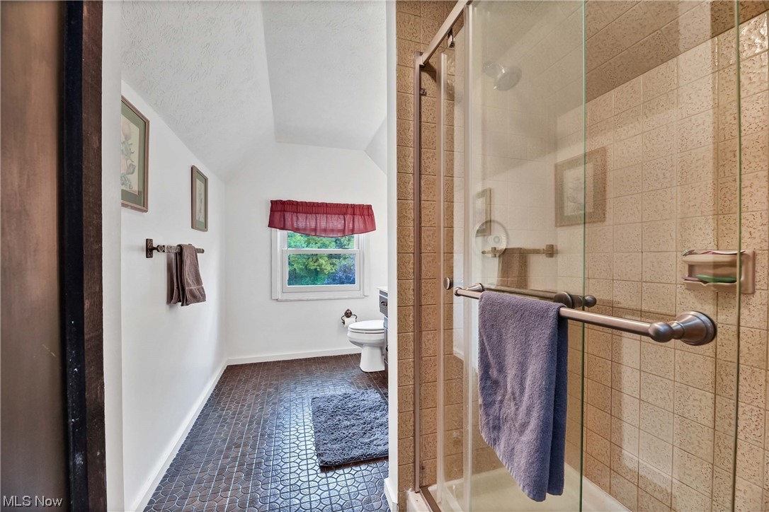 5740 Hauserman Road Parma, OH 44130 - Photo 30 of 35 Bathroom featuring an enclosed shower, toilet, and tile floors