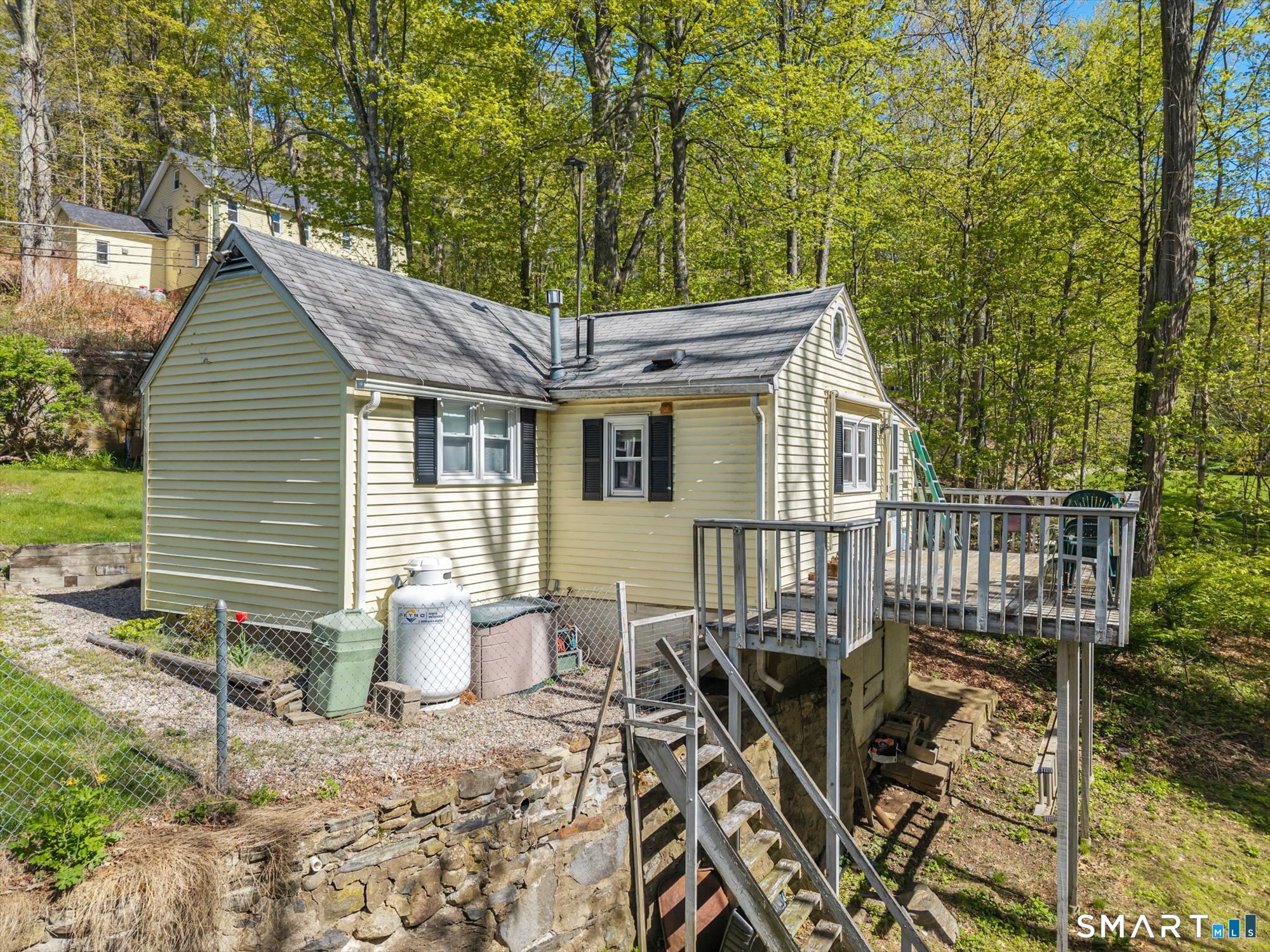 93 Torrington Avenue Canton, CT 06019 - Photo 23 of 24 a view of a house with backyard and sitting area
