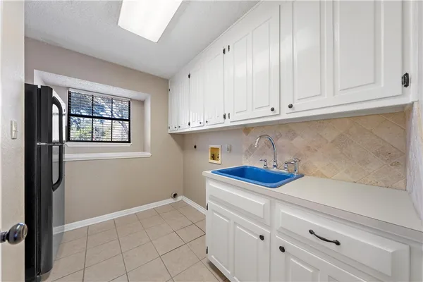 a kitchen with a cabinets and window