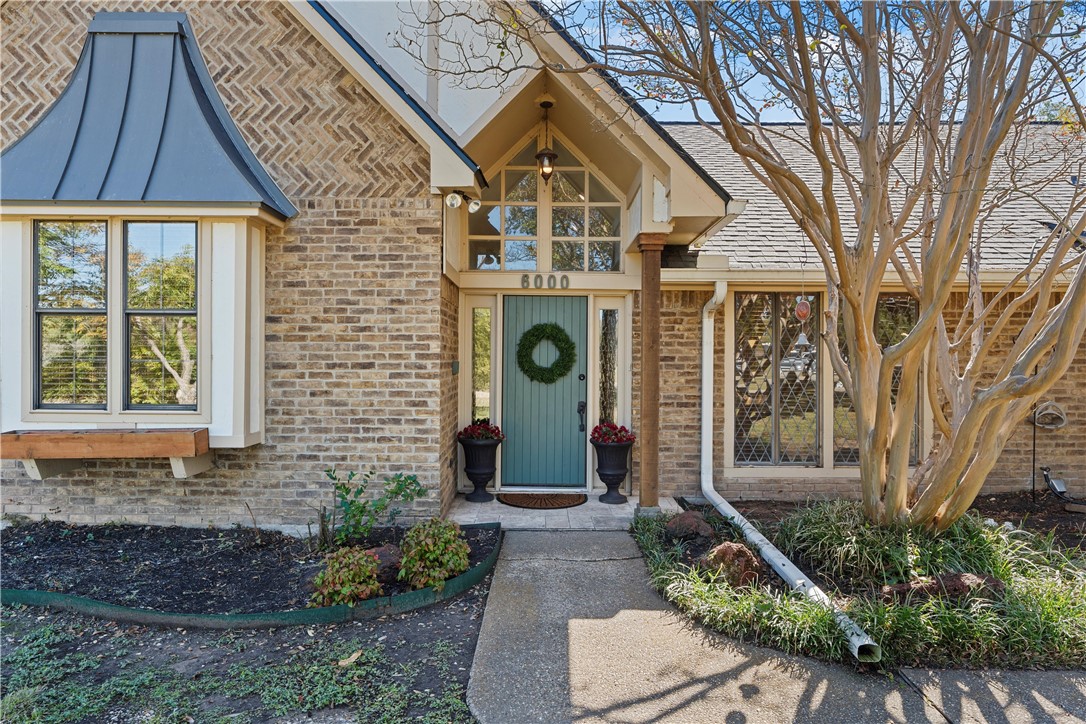 6000 Flat Rock Road Waco, TX 76708 - Photo 3 of 44 a front view of a house with garden