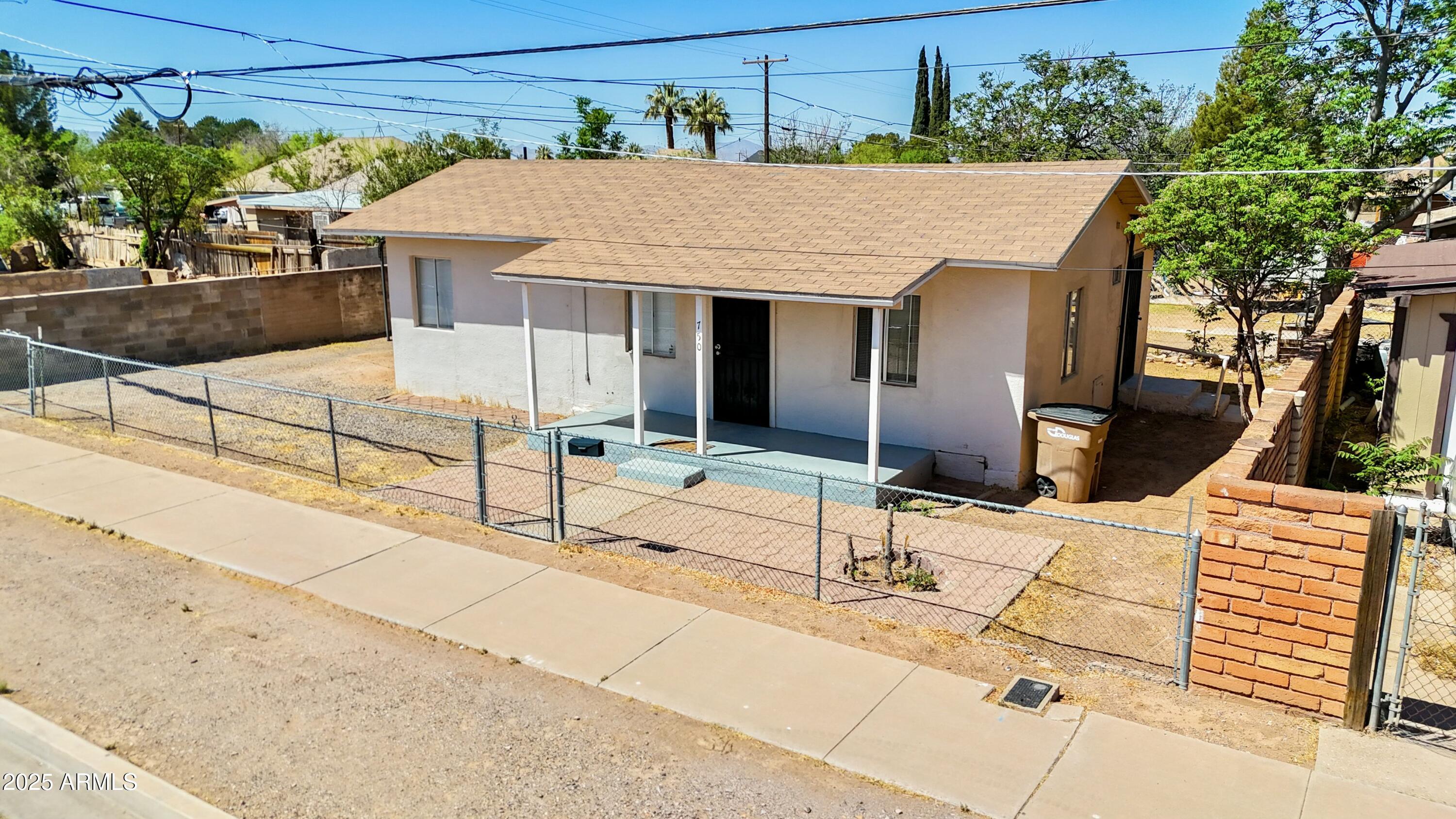 a aerial view of a house with sitting area