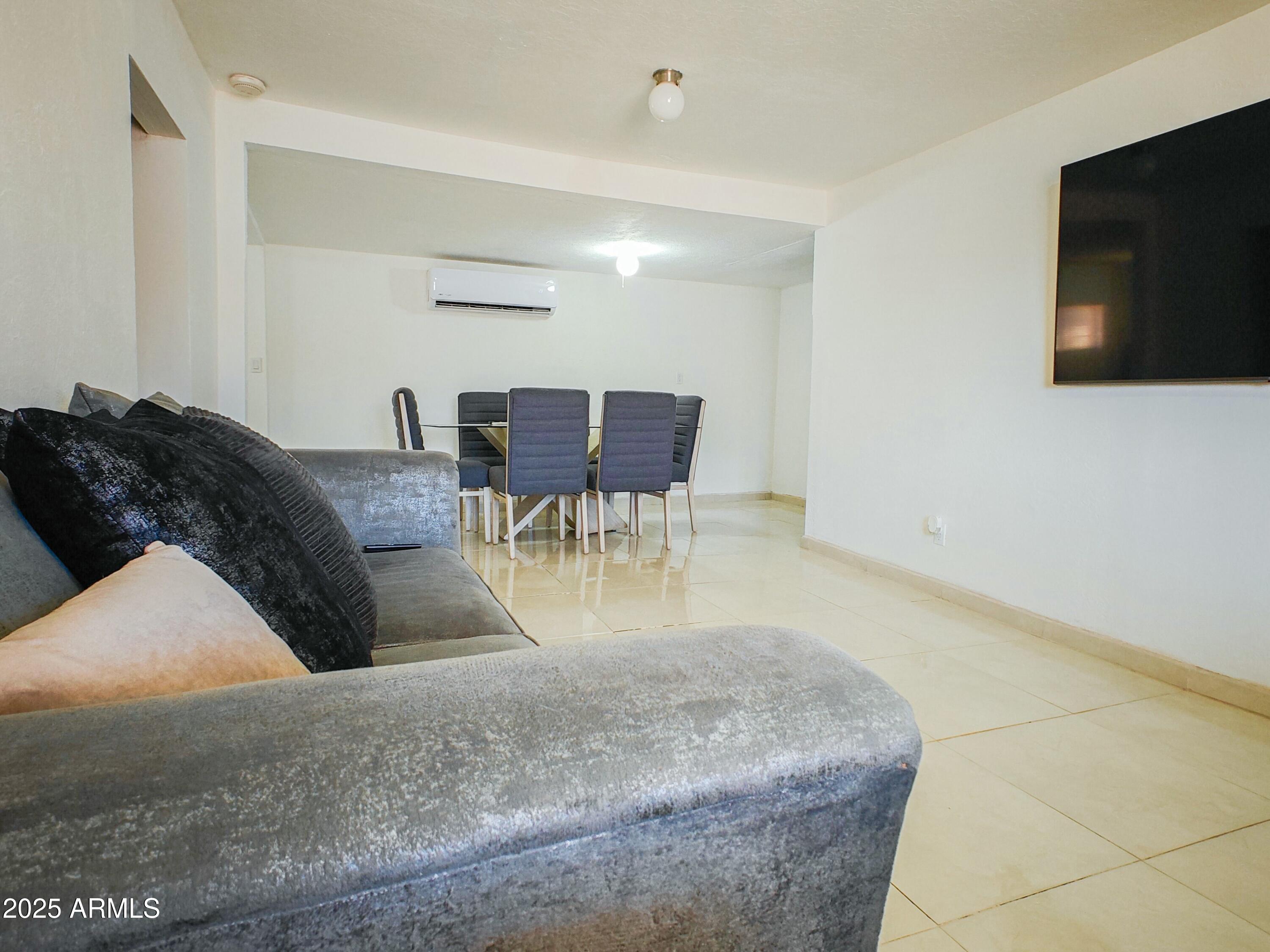 750 A Avenue Douglas, AZ 85607 - Photo 13 of 19 a living room with furniture and a flat screen tv