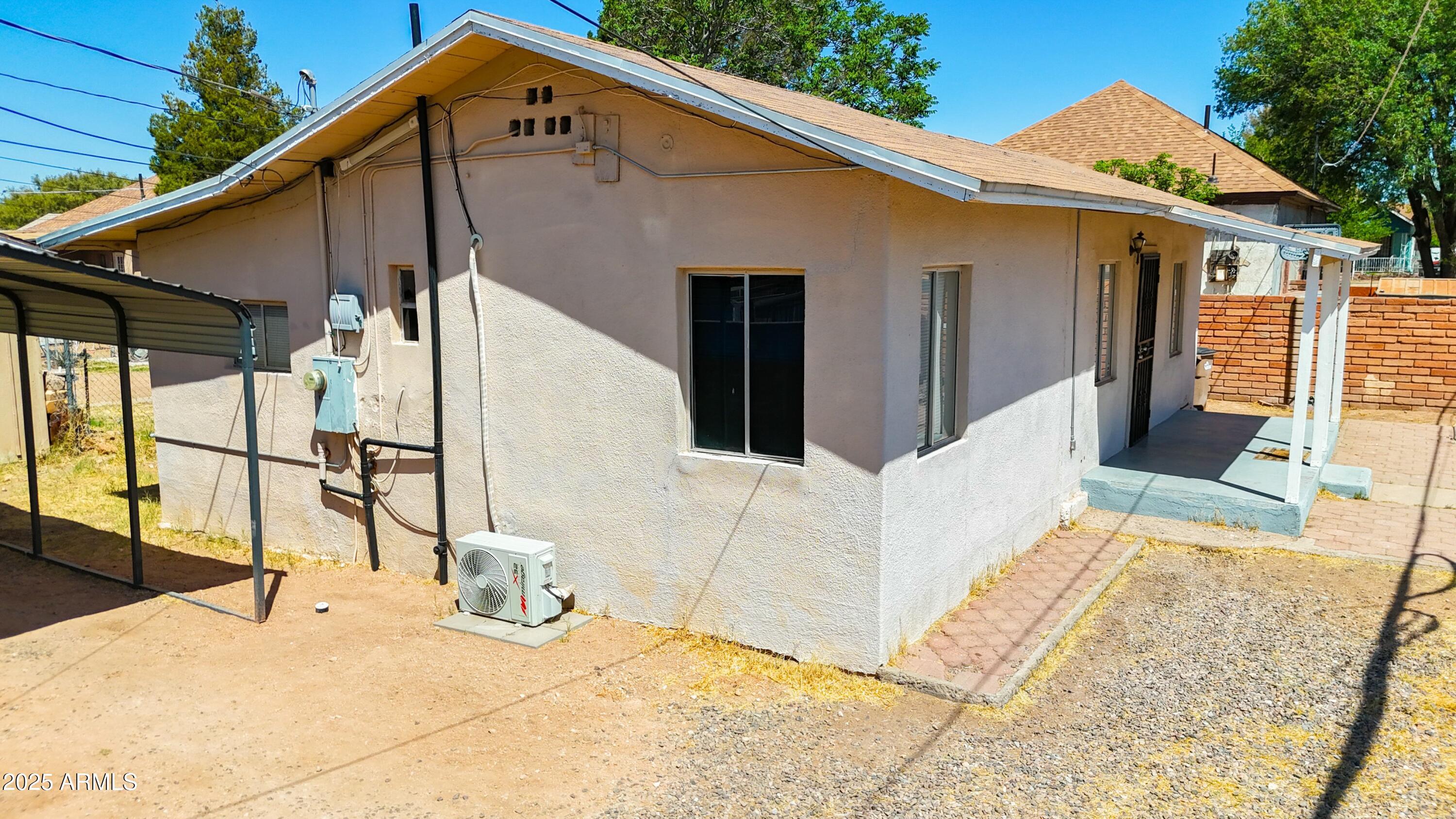 750 A Avenue Douglas, AZ 85607 - Photo 4 of 19 a view of a house with roof and wooden fence