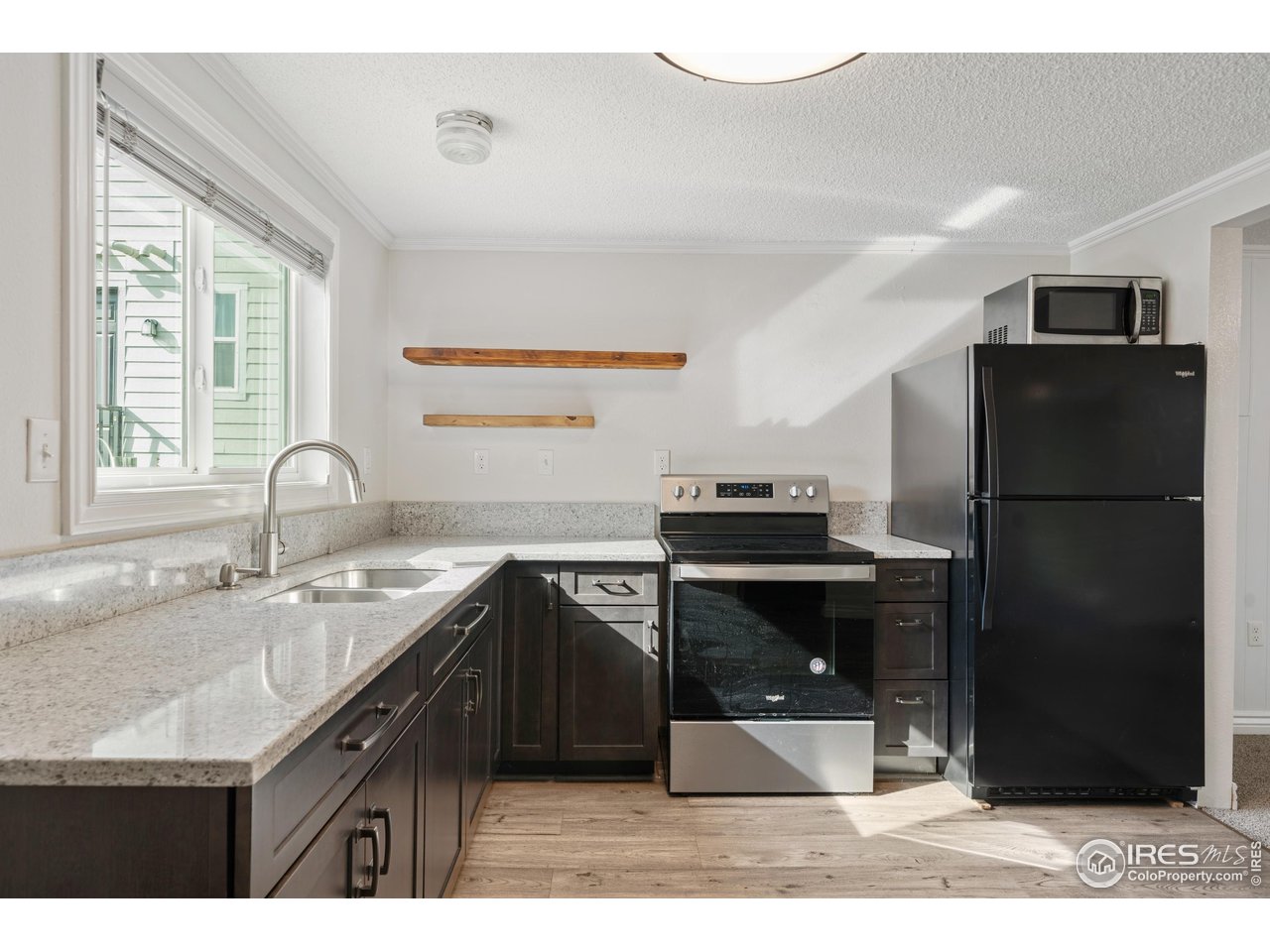 116 South Clifton Street Brush, CO 80723 - Photo 16 of 33 a kitchen with a sink a refrigerator and a sink