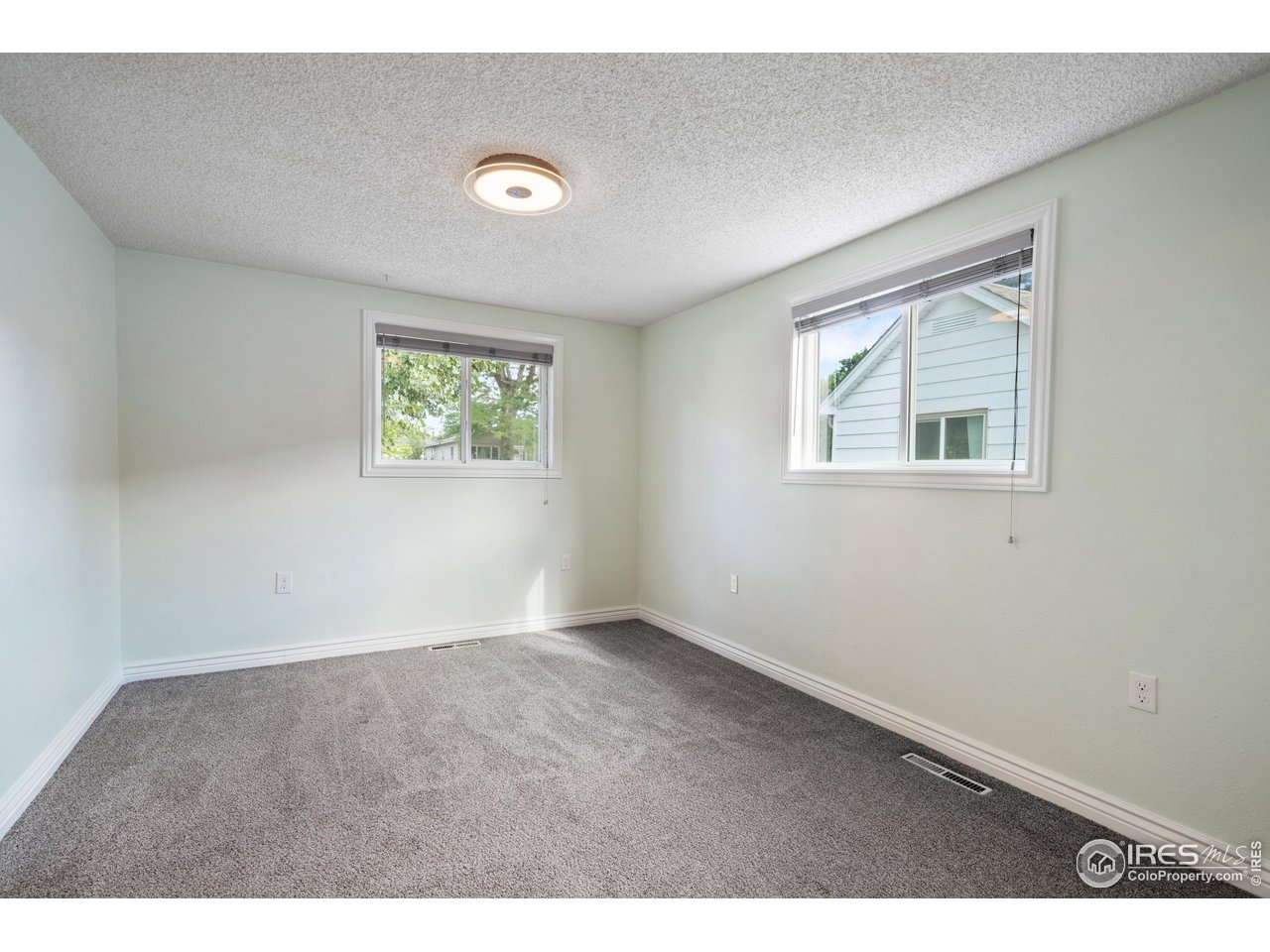 116 South Clifton Street Brush, CO 80723 - Photo 9 of 33 an empty room with windows