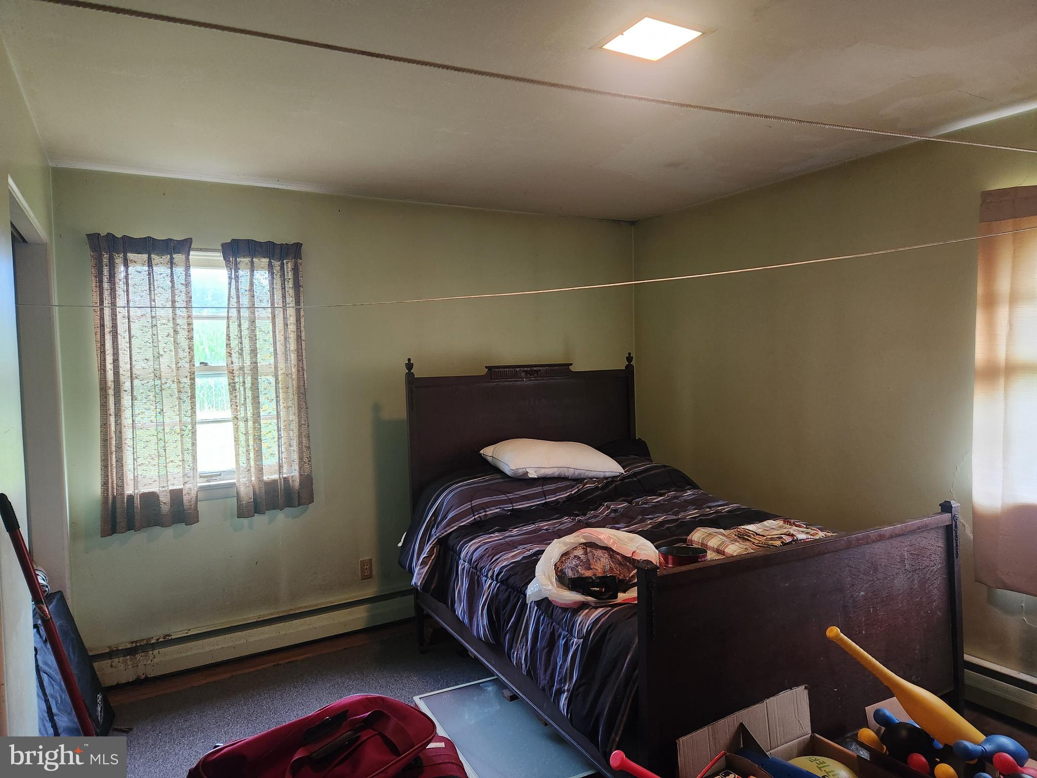 32 Bachmanville Road Hershey, PA 17033 - Photo 19 of 25 a bed sitting in a bedroom next to a window