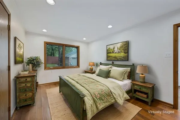 a bed room with a bed and a television