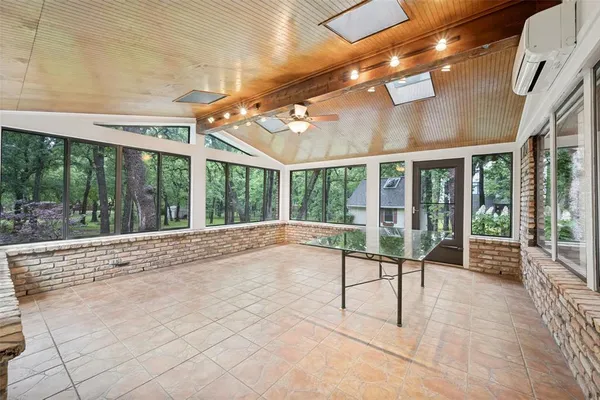 a view of an entryway with a floor to ceiling window