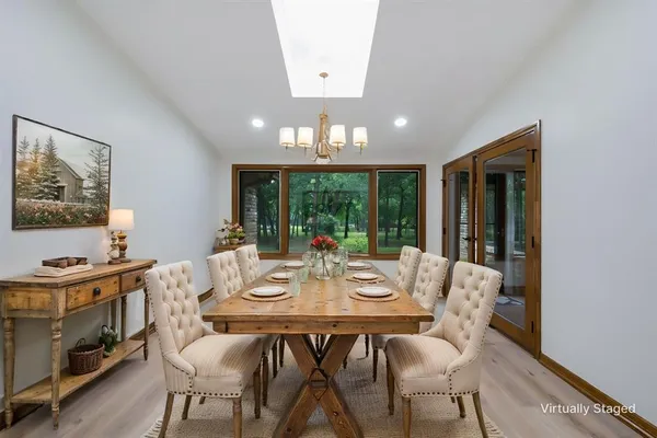 a view of a dining room with furniture window and outside view