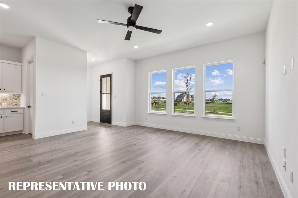 1331 Rooted Road Frisco, TX 75033 - Photo 4 of 14 Light, bright and airy, this family room is the perfect place for your family to gather! REPRESENTATIVE PHOTO