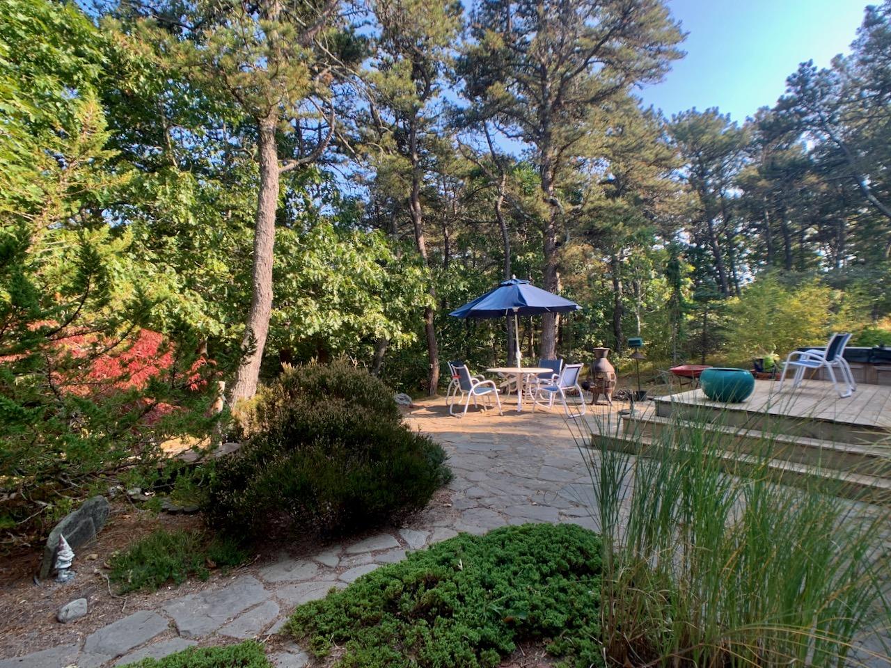 9 Sandy Lane Truro, MA 02666 - Photo 12 of 13 a garden view with a seating space