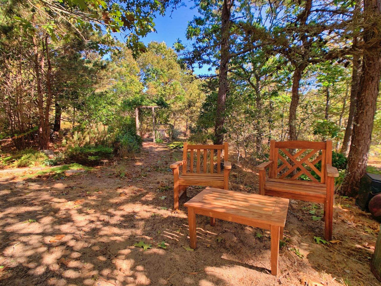 9 Sandy Lane Truro, MA 02666 - Photo 13 of 13 a backyard of a house with outdoor seating