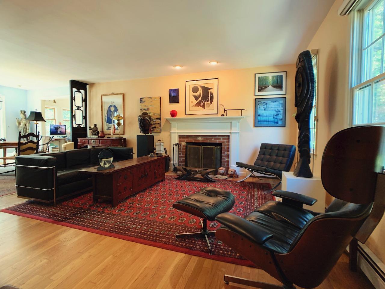 9 Sandy Lane Truro, MA 02666 - Photo 2 of 13 a living room with furniture fireplace and a large window