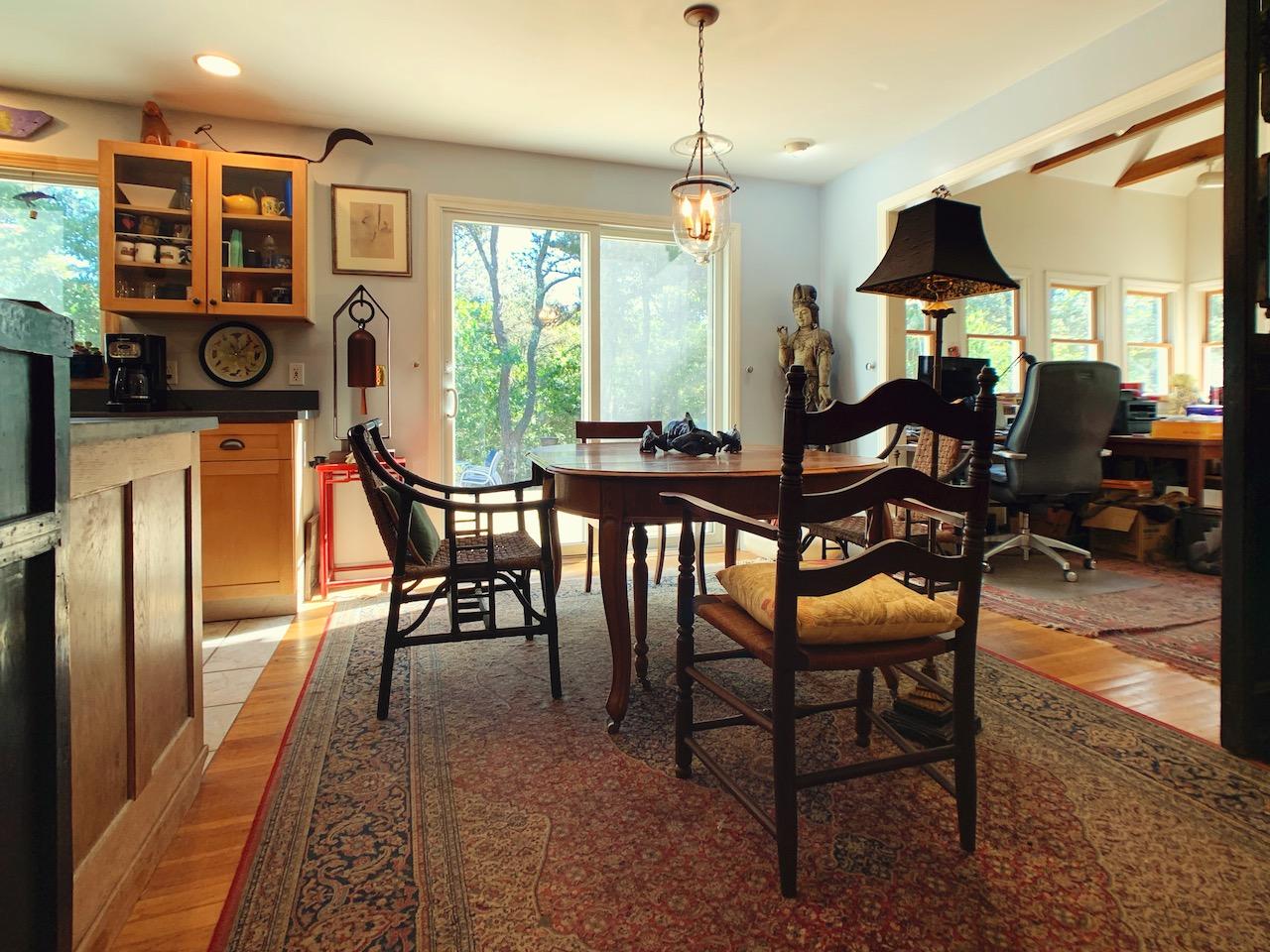 9 Sandy Lane Truro, MA 02666 - Photo 4 of 13 a view of a dining room with furniture window and outside view
