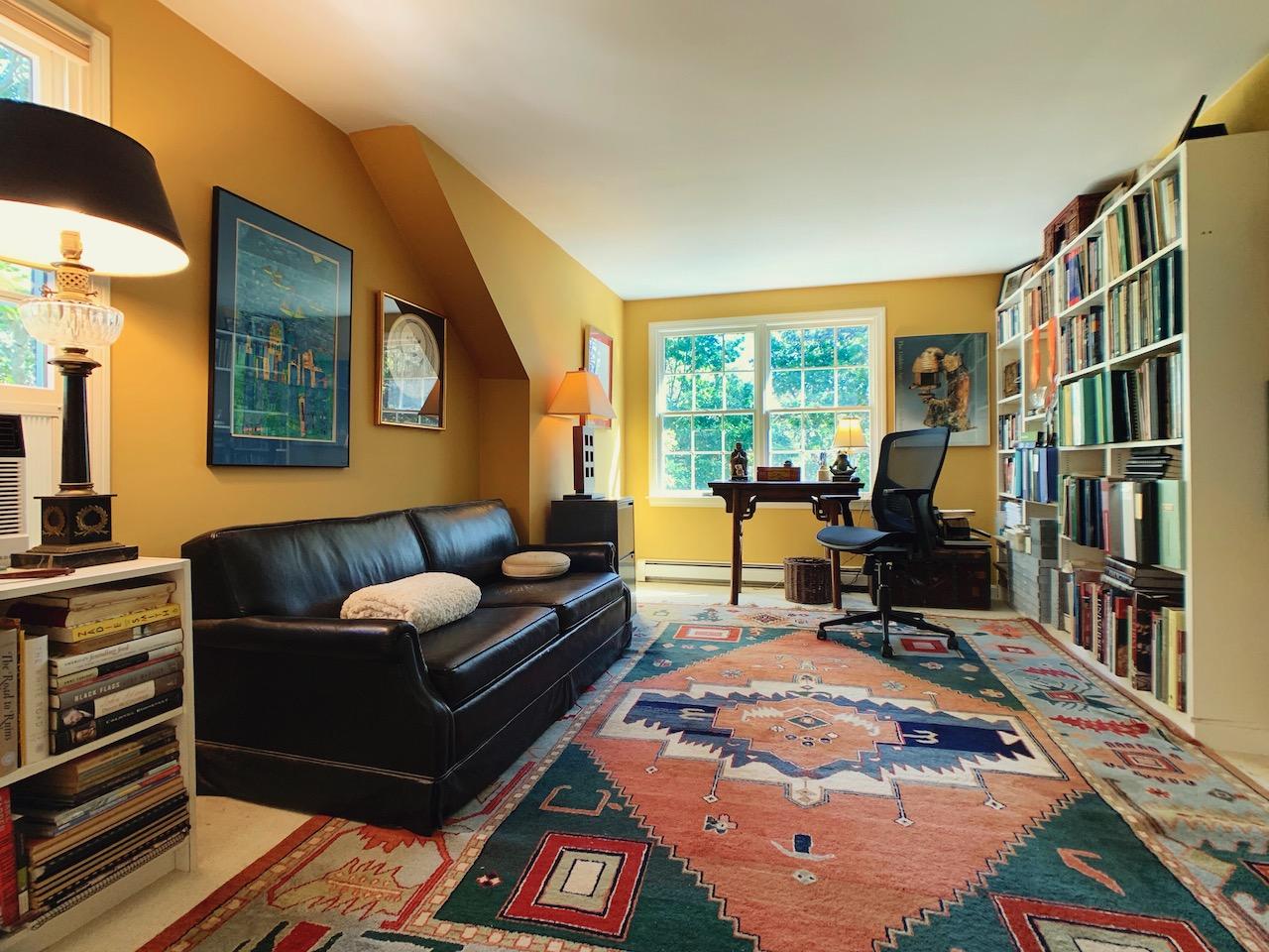 9 Sandy Lane Truro, MA 02666 - Photo 10 of 13 a living room with furniture and a bookshelf