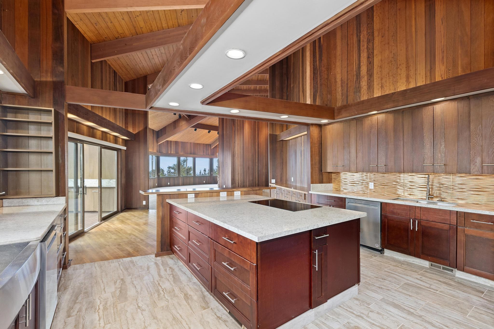 2450 Piiholo Road Makawao, HI 96768 - Photo 5 of 39 a kitchen with a stove sink and cabinets