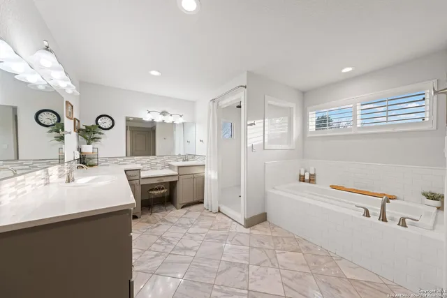 a view of walk in closet with clothes