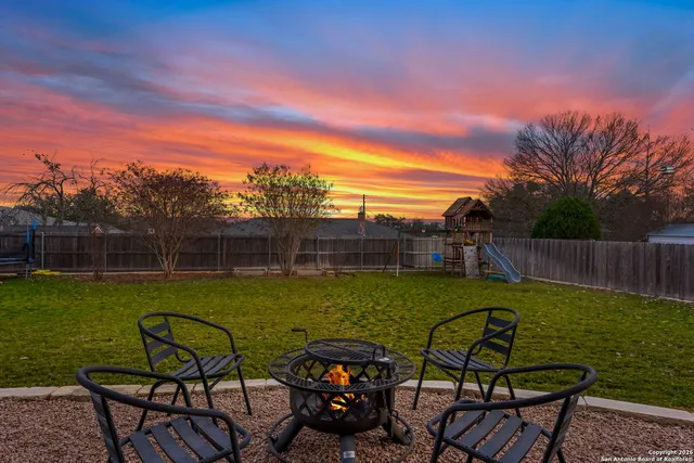 a view of a swimming pool with a yard