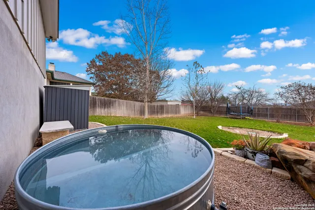 a view of a house with a yard patio and sitting area