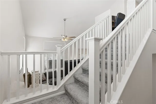 an aerial view of multiple houses with yard