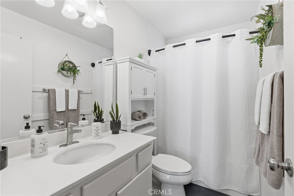 42156 Chestnut Drive Temecula, CA 92591 - Photo 18 of 33 a bathroom with a sink toilet and shower