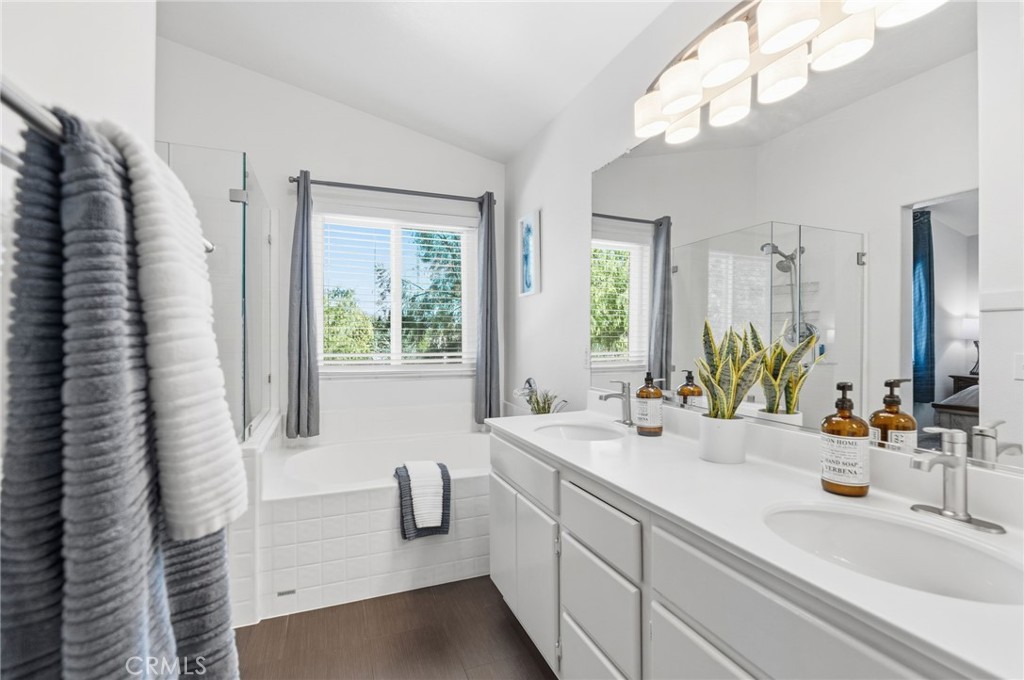 42156 Chestnut Drive Temecula, CA 92591 - Photo 23 of 33 a bathroom with a double vanity sink and a mirror