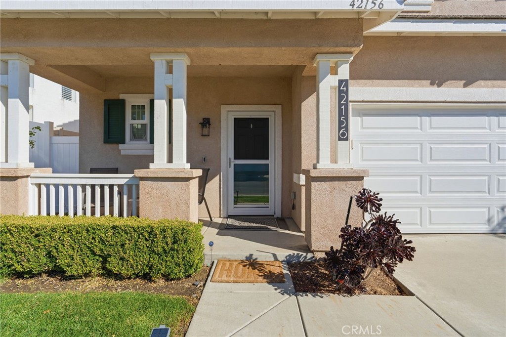 42156 Chestnut Drive Temecula, CA 92591 - Photo 3 of 33 a front view of a house with a garden