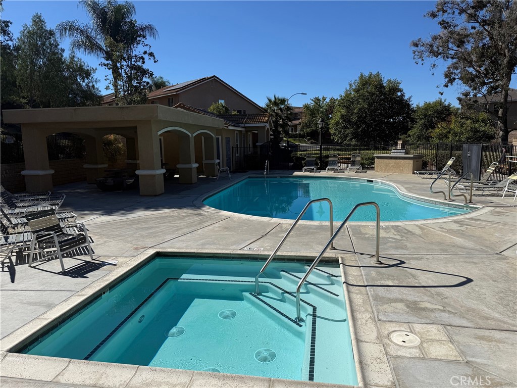 42156 Chestnut Drive Temecula, CA 92591 - Photo 32 of 33 a view of a swimming pool with a patio