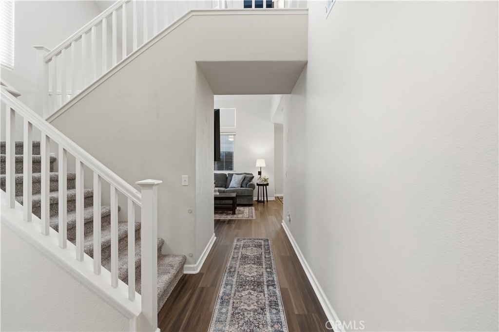 42156 Chestnut Drive Temecula, CA 92591 - Photo 4 of 33 a view of a hallway with a white walls and stairs