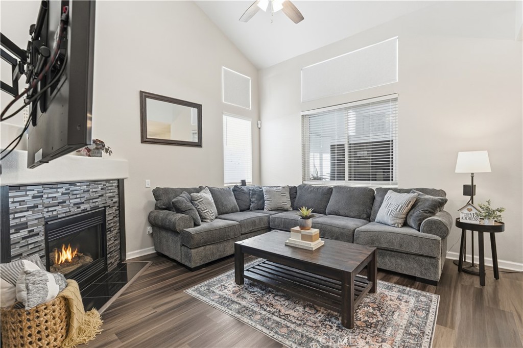 42156 Chestnut Drive Temecula, CA 92591 - Photo 5 of 33 a living room with furniture a rug and a fireplace