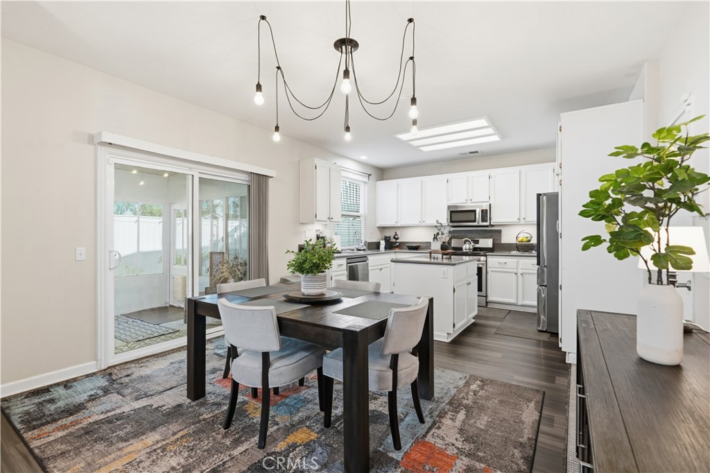 42156 Chestnut Drive Temecula, CA 92591 - Photo 10 of 33 a view of a dining room with furniture window and wooden floor